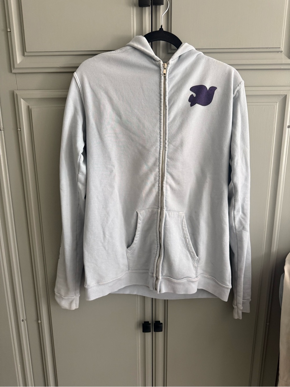 Free City Light Blue Zip Hoodie with Purple Bird Graphic